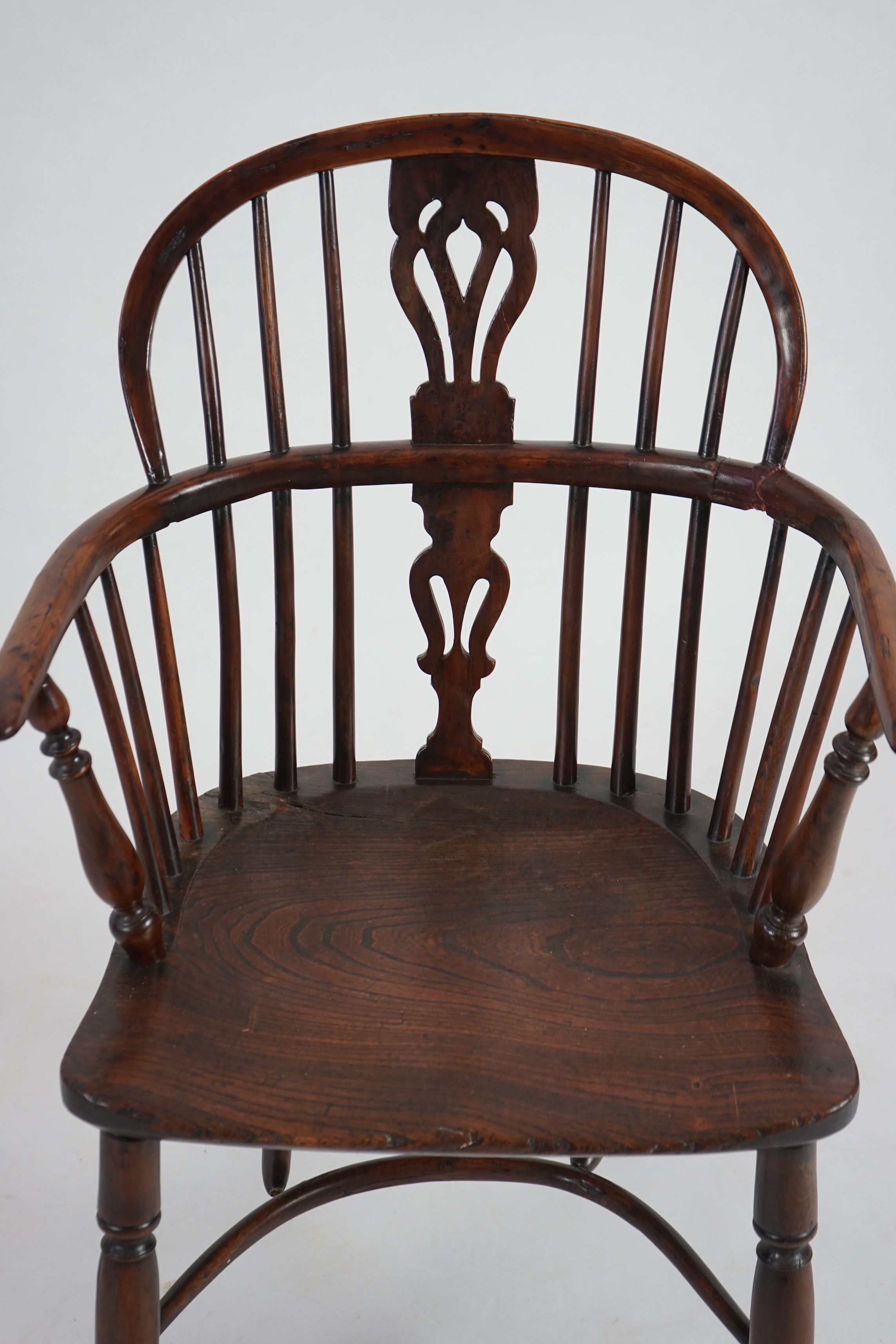 A mid 19th century yew, elm and ash Windsor chair